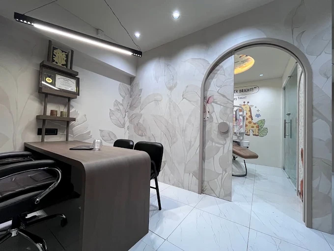An arched doorway leading from the consultation room into the jungle room