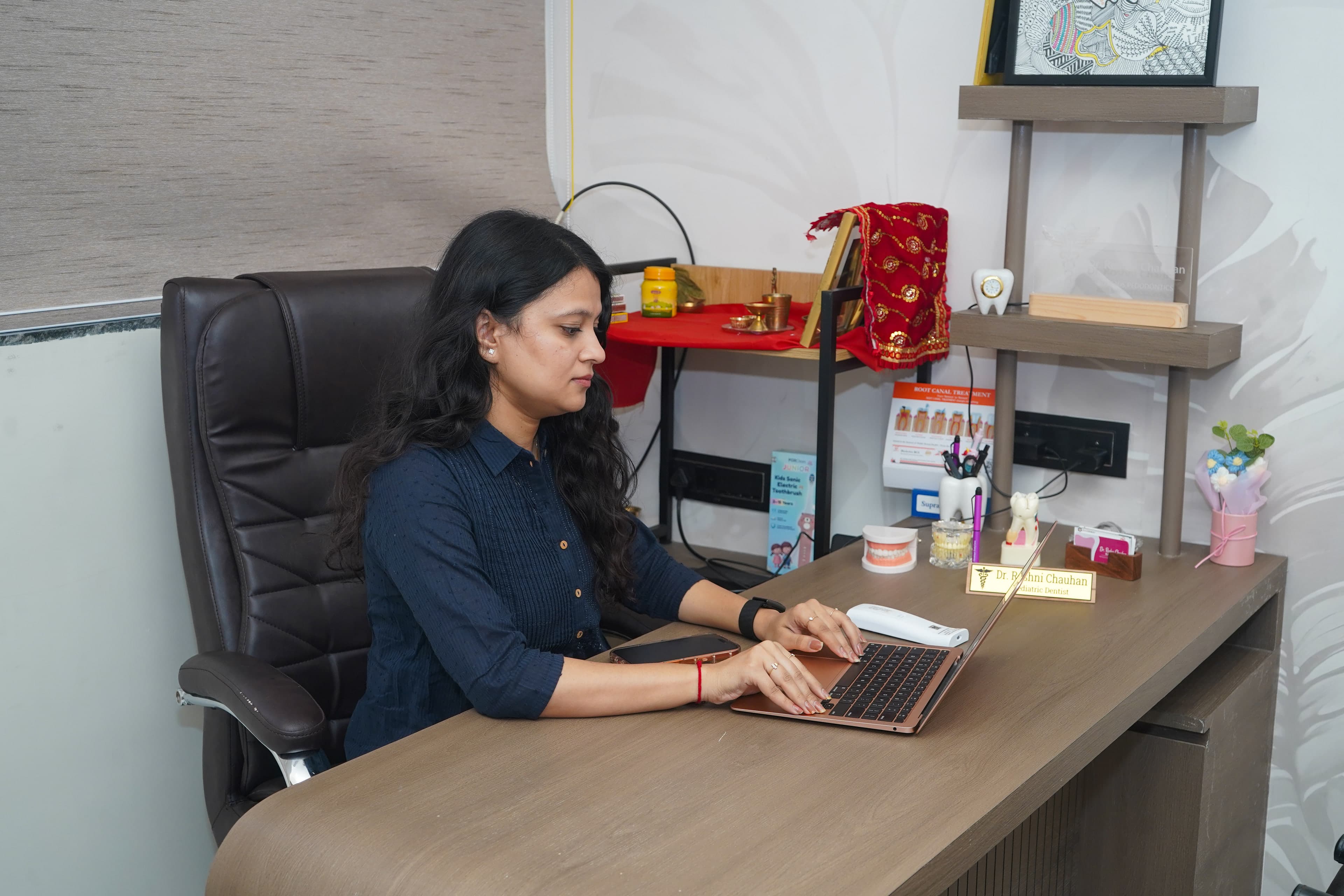 The consultation room at Tic Tac Tooth, with a wood desk and no dental chair, where the first conversation happens